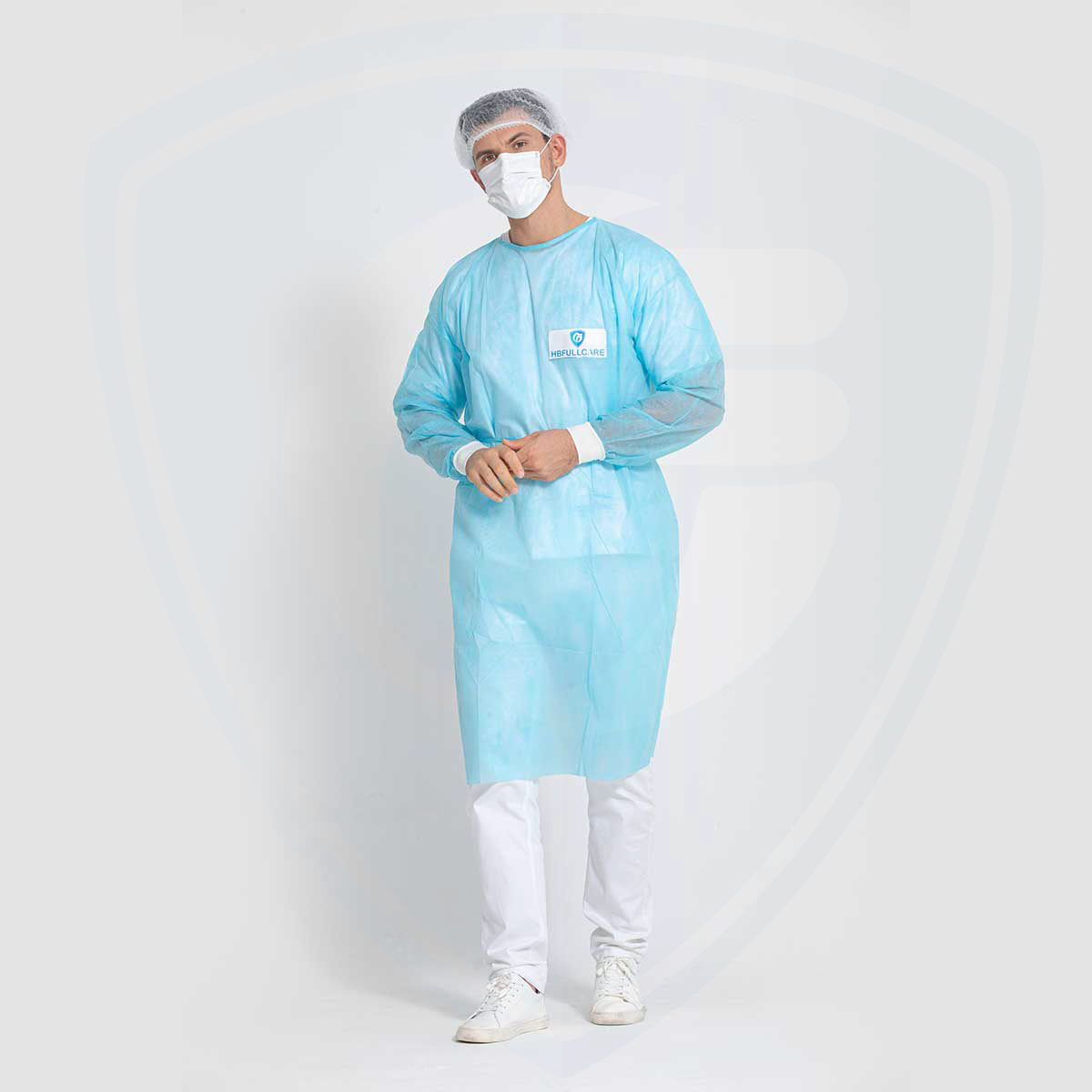 Camice chirurgico monouso in polipropilene blu da 25 g/mq con polsino in maglia